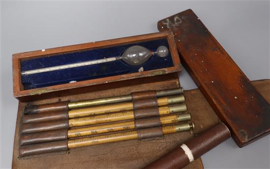 An Inland Revenue leather cased beverage measure and two cased thermometers